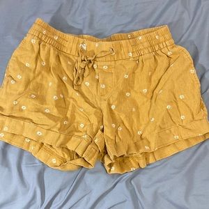 Yellow shorts with daisies